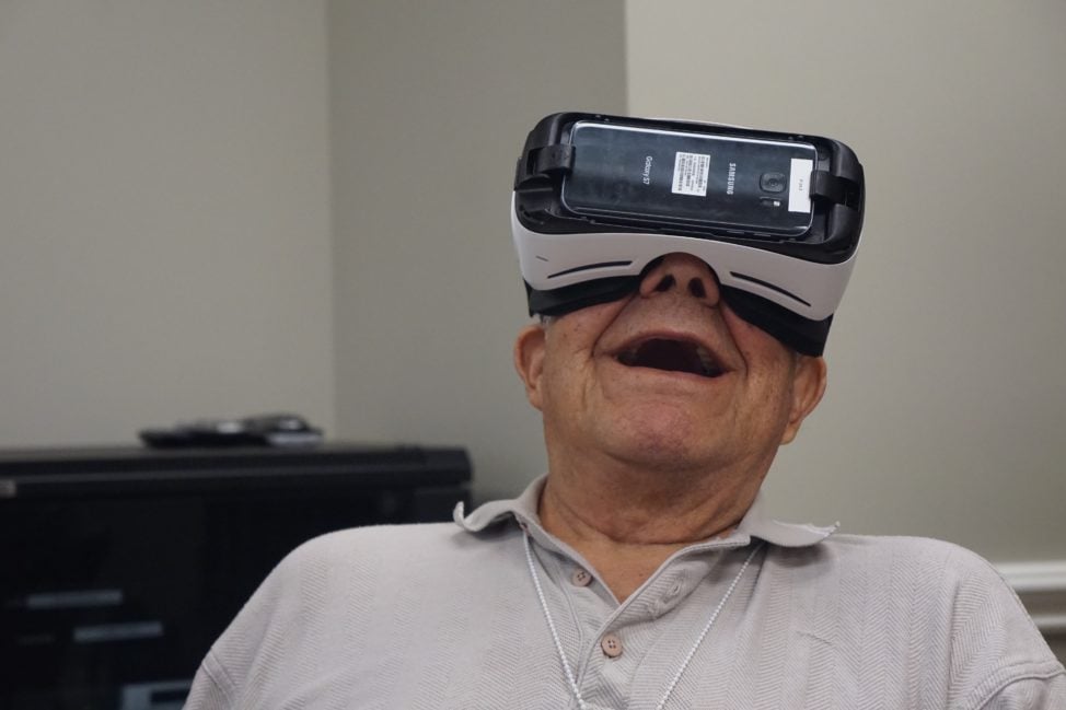 A senior resident at Maplewood Senior Living experiences virtual reality with a Rendever VR headset. (Maplewood Senior Living)